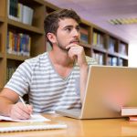 44843446 – student studying in the library with laptop at the university