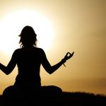 11445742 – beauty girl in lotus pose on sunrise beach