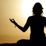 11445742 – beauty girl in lotus pose on sunrise beach